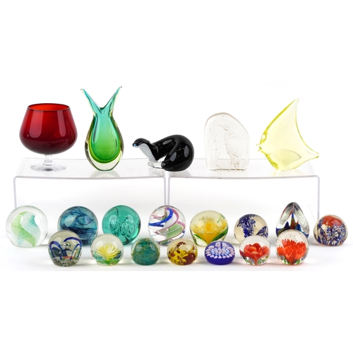 662 - A small collection of glass paperweights together with a glass model of an otter, a vase and an over... 