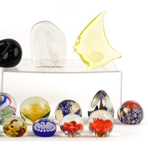 662 - A small collection of glass paperweights together with a glass model of an otter, a vase and an over... 