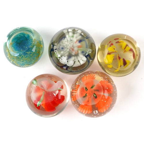 662 - A small collection of glass paperweights together with a glass model of an otter, a vase and an over... 