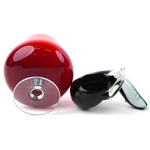 662 - A small collection of glass paperweights together with a glass model of an otter, a vase and an over... 