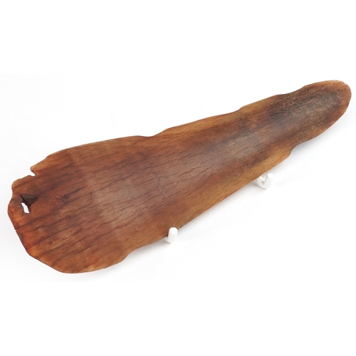 98 - A Chinese rhinoceros horn leaf shaped brush washer carved in relief to one side, pierced to the top ... 