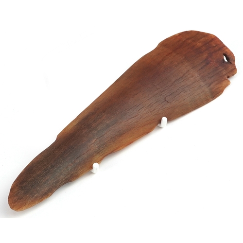 98 - A Chinese rhinoceros horn leaf shaped brush washer carved in relief to one side, pierced to the top ... 