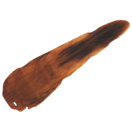 98 - A Chinese rhinoceros horn leaf shaped brush washer carved in relief to one side, pierced to the top ... 