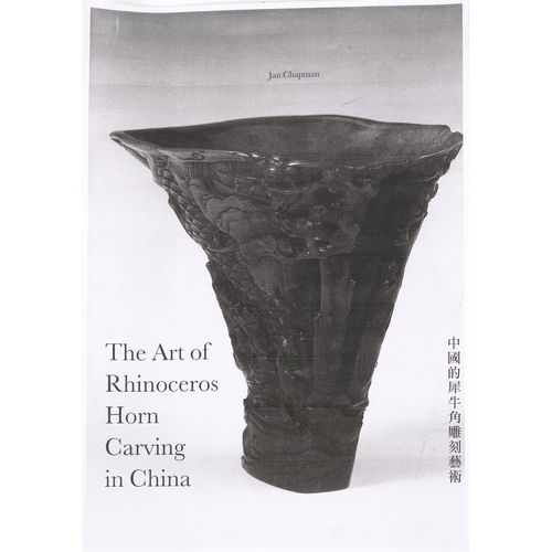 98 - A Chinese rhinoceros horn leaf shaped brush washer carved in relief to one side, pierced to the top ... 