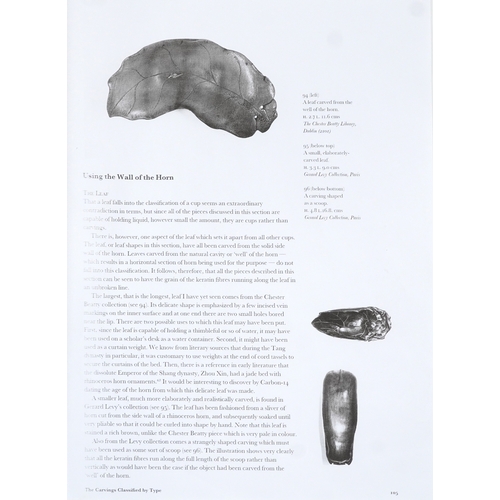 98 - A Chinese rhinoceros horn leaf shaped brush washer carved in relief to one side, pierced to the top ... 