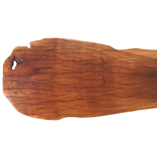 98 - A Chinese rhinoceros horn leaf shaped brush washer carved in relief to one side, pierced to the top ... 