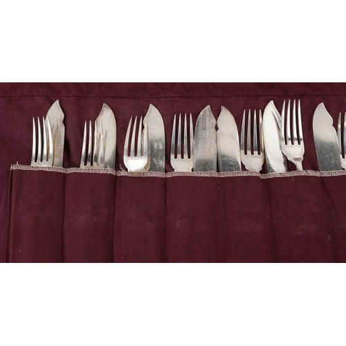 3747 - A set of twelve King's pattern silver plated knives and forks with cloth bag.