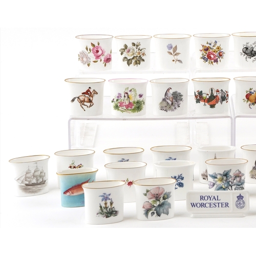 667 - A collection of Royal Worcester fine bone china cigarette holders, variously decorated, 7cm wide.