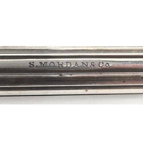 69 - Three silver propelling pencil cases, the largest 7.7cm in length, total 40.2g.