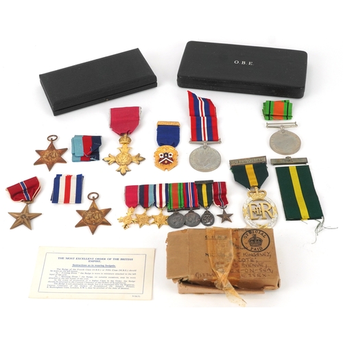 2692 - British military medals including an OBE with box, Territorial medal, dress medals and postage box a... 