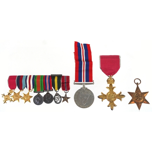 2692 - British military medals including an OBE with box, Territorial medal, dress medals and postage box a... 