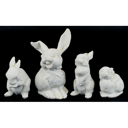 624 - A group of four Kaiser porcelain models of rabbits, the largest 13cm high.