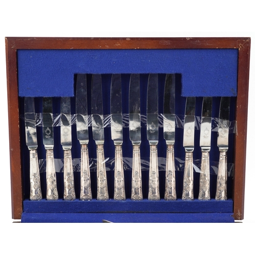 3753 - A six place setting of Sheffield silver plated cutlery housed in a mahogany canteen, 40cm wide.