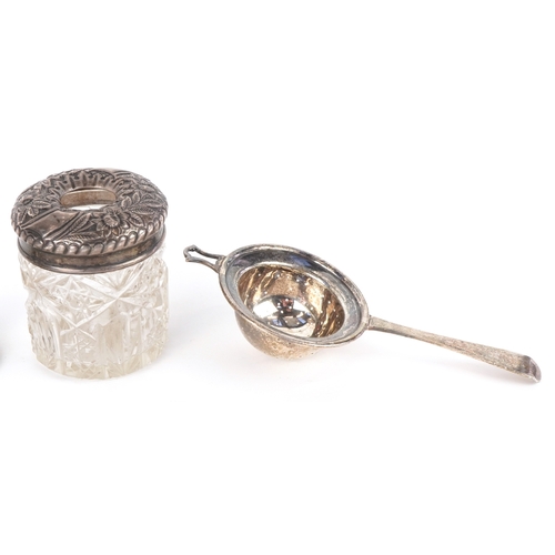 3620 - Antique and later silver including a tea strainer, cut glass jars with silver lids, Georgian spoons ... 