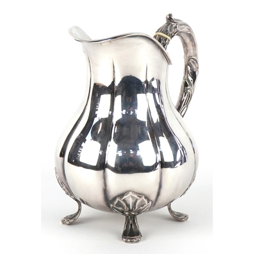 3562 - Carl M. Cohr of Fredericia, a Danish silver milk jug raised on four feet having naturalistic handle,... 