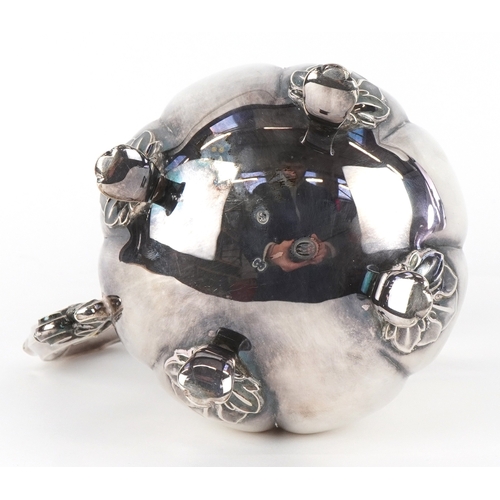 3562 - Carl M. Cohr of Fredericia, a Danish silver milk jug raised on four feet having naturalistic handle,... 