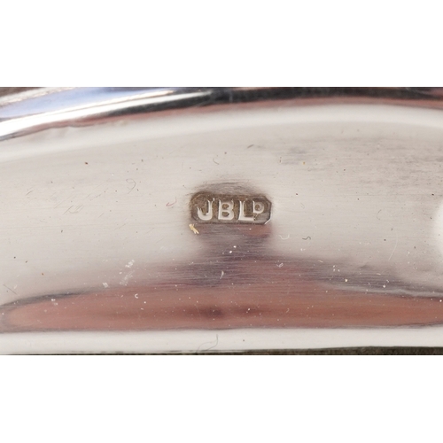 3639 - John Bull Ltd., an Art Nouveau style embossed silver photo frame, London 1988, 23.5cm x 18cm, apertu... 