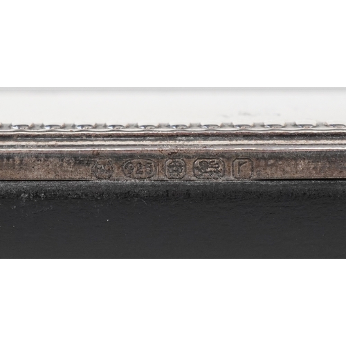 3613 - Two Elizabeth II rectangular silver easel photo frames by Carrs and Kitney & Co., the largest 15.5cm... 