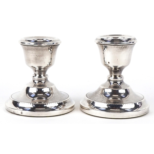 3677 - A T Cannon Ltd., a pair of Elizabeth II circular silver dwarf candlesticks, Birmingham 1973, 7cm hig... 