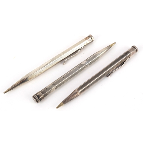 73 - Four engine turned silver propelling pencils including Yard-O-Led, the largest 12.5cm in length.