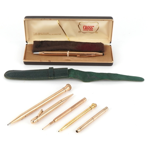 85 - Six gold plated and yellow metal propelling pencils, some with engine turned decoration including Cr... 