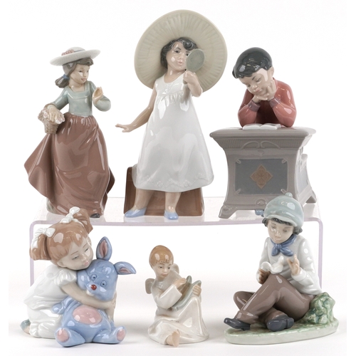 656 - Six Nao porcelain figures of young children including a boy at a desk, young girl with a teddy bear ... 