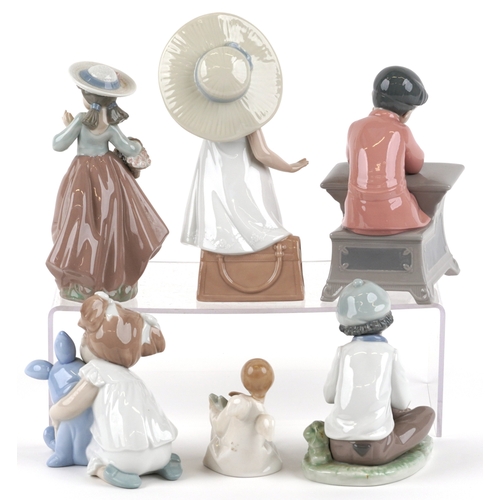 656 - Six Nao porcelain figures of young children including a boy at a desk, young girl with a teddy bear ... 
