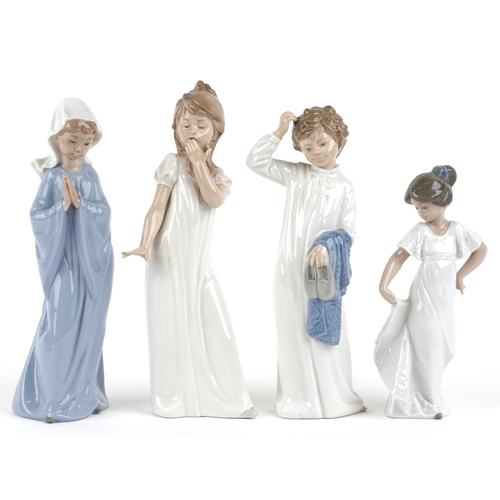 655 - Four Nao porcelain figures including a boy and girl in nightclothes, the largest 27cm high.