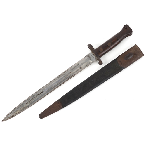2852 - A British military issue War Department bayonet and scabbard, impressed marks to the blade, 44cm in ... 