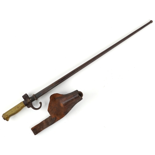 2850 - A French military interest bayonet and scabbard with cross blade, 65cm in length.