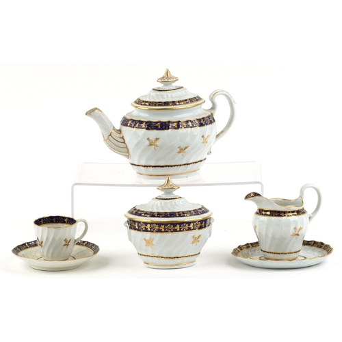 548 - An early 19th century Royal Worcester part tea service with hand painted gilded thistle and cobalt b... 