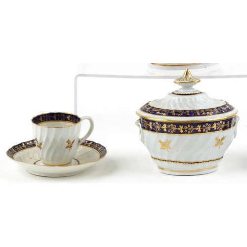 548 - An early 19th century Royal Worcester part tea service with hand painted gilded thistle and cobalt b... 