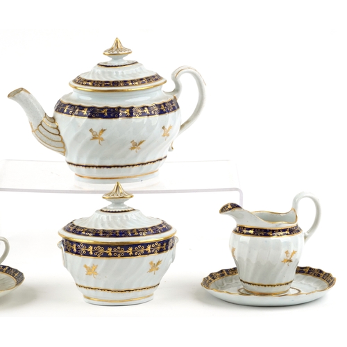 548 - An early 19th century Royal Worcester part tea service with hand painted gilded thistle and cobalt b... 