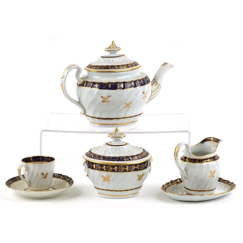 548 - An early 19th century Royal Worcester part tea service with hand painted gilded thistle and cobalt b... 