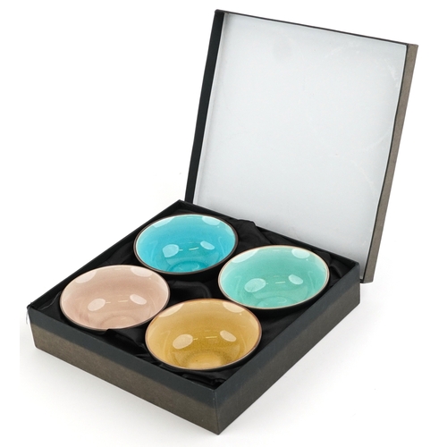558 - A set of four Japanese crackle glazed rice bowls, 11cm in diameter.