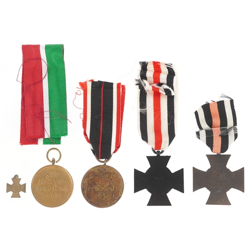 2725 - Four German military interest medals and a dress medal.