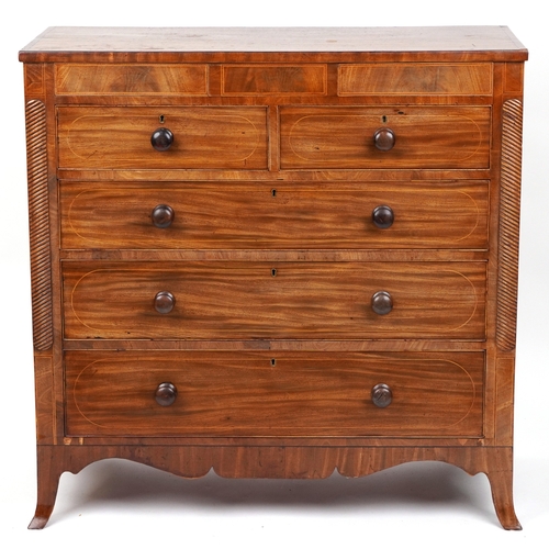 2001 - A late George III mahogany chest of two short and three long drawers raised on splayed bracket feet,... 
