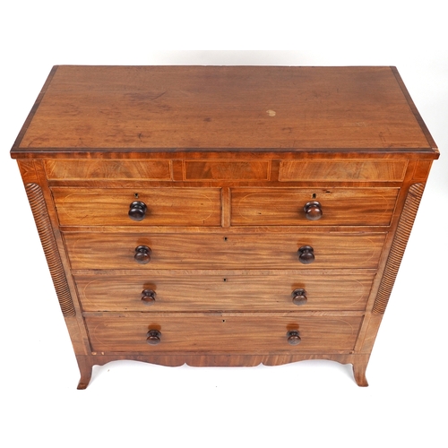 2001 - A late George III mahogany chest of two short and three long drawers raised on splayed bracket feet,... 