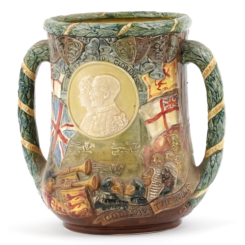 627 - A large Royal Doulton loving cup to commemorate the 25 year reign of King George V & Queen Mary, edi... 