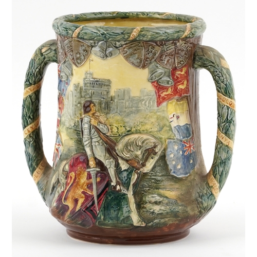 627 - A large Royal Doulton loving cup to commemorate the 25 year reign of King George V & Queen Mary, edi... 