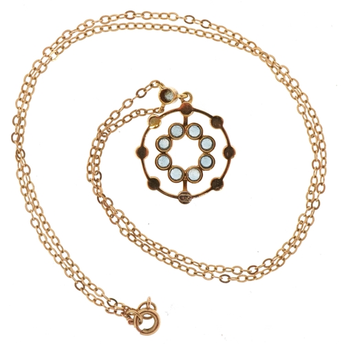 3048 - An Edwardian 15ct gold blue stone and seed pearl openwork pendant on a 9ct gold necklace, 2.4cm high... 