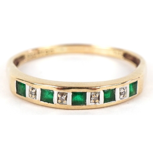 3279 - A 9ct gold diamond and green stone half eternity ring, size S, 1.6g.
