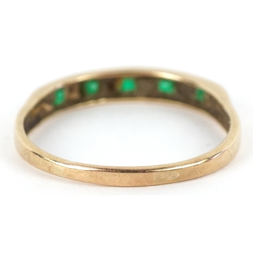 3279 - A 9ct gold diamond and green stone half eternity ring, size S, 1.6g.