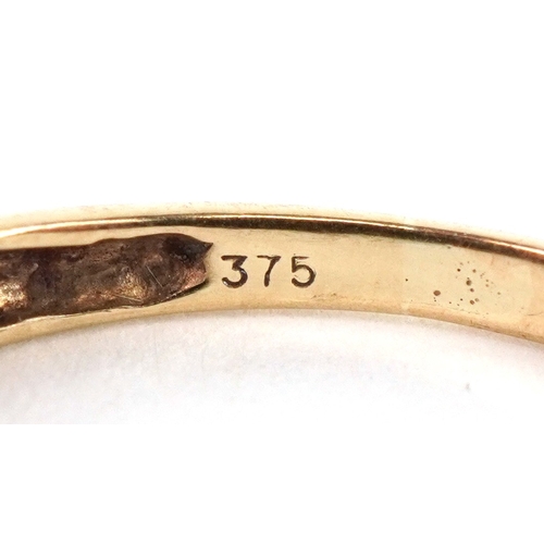 3279 - A 9ct gold diamond and green stone half eternity ring, size S, 1.6g.