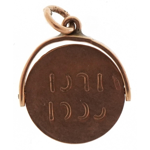 3187 - A 9ct gold Good Luck spinner charm, 1.4cm high, 1.1g.