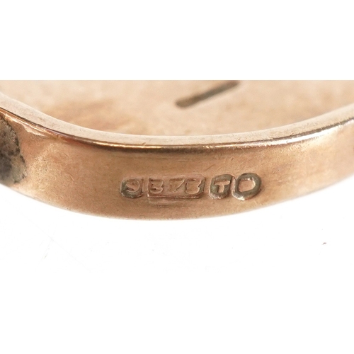 3187 - A 9ct gold Good Luck spinner charm, 1.4cm high, 1.1g.