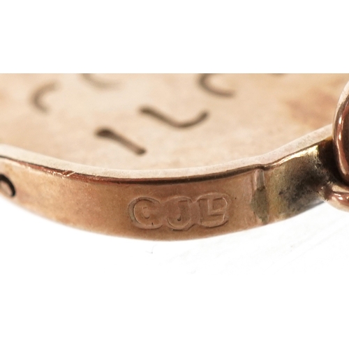 3187 - A 9ct gold Good Luck spinner charm, 1.4cm high, 1.1g.