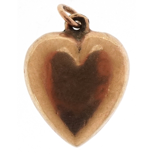 3294 - A 9ct gold love heart pendant, 1.6cm high, 1.1g.