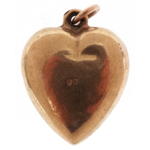 3294 - A 9ct gold love heart pendant, 1.6cm high, 1.1g.