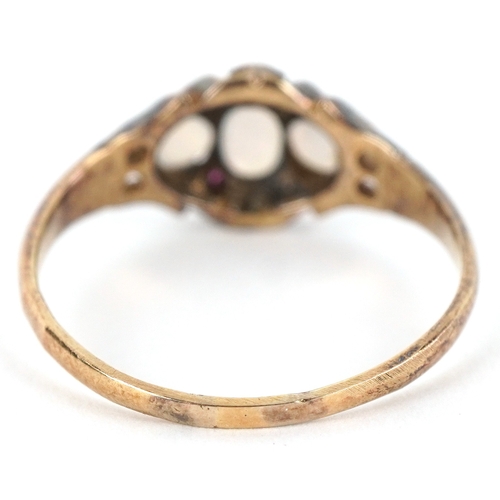 3165 - An antique unmarked gold graduated opal and ruby cluster ring with pierced shoulders, size N, 2.1g.